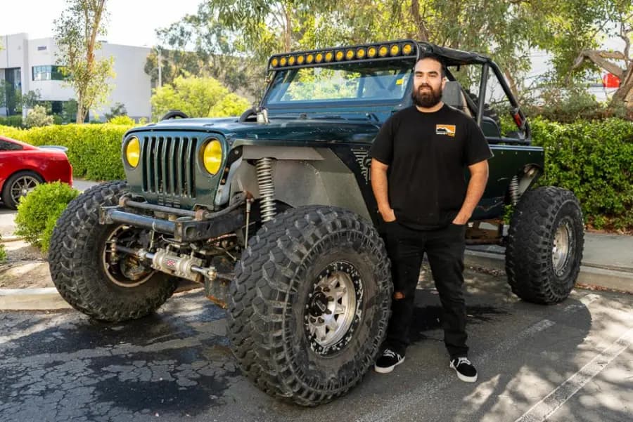 An ASC employee with his lifted Jeep at the company car show