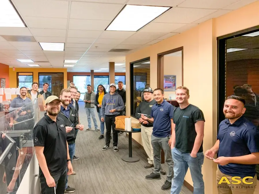 ASC office staff gathered for Pi Day