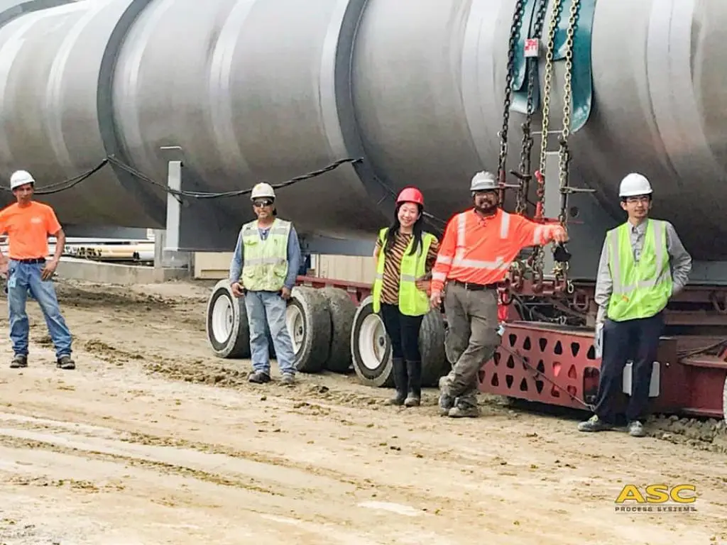 The ASC installation crew standing in front of a delivered AAC concrete autoclave