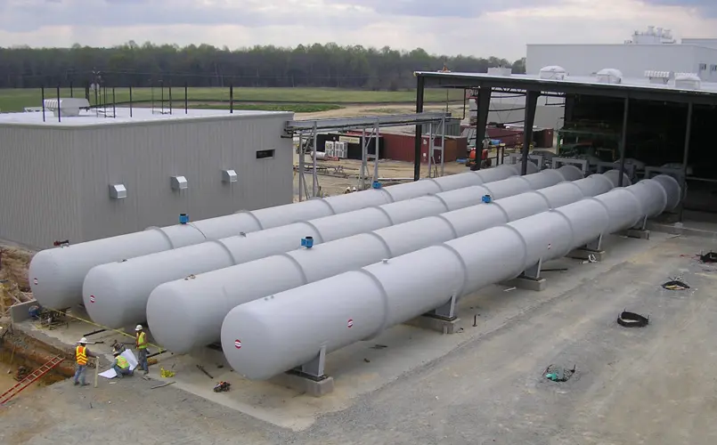 A row of long, insulated ASC AAC concrete autoclaves outside the shop