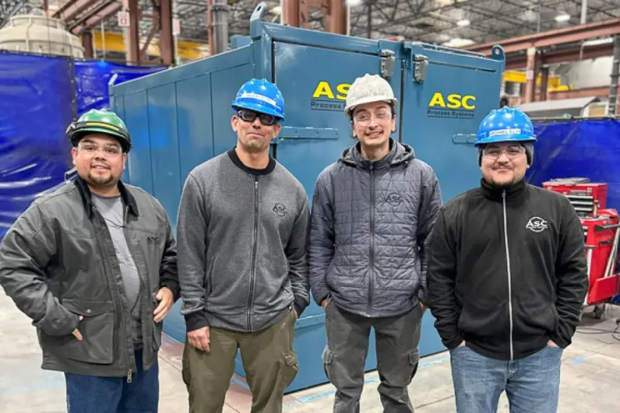 The ASC shipping crew in hard hats with the first shipment of the year