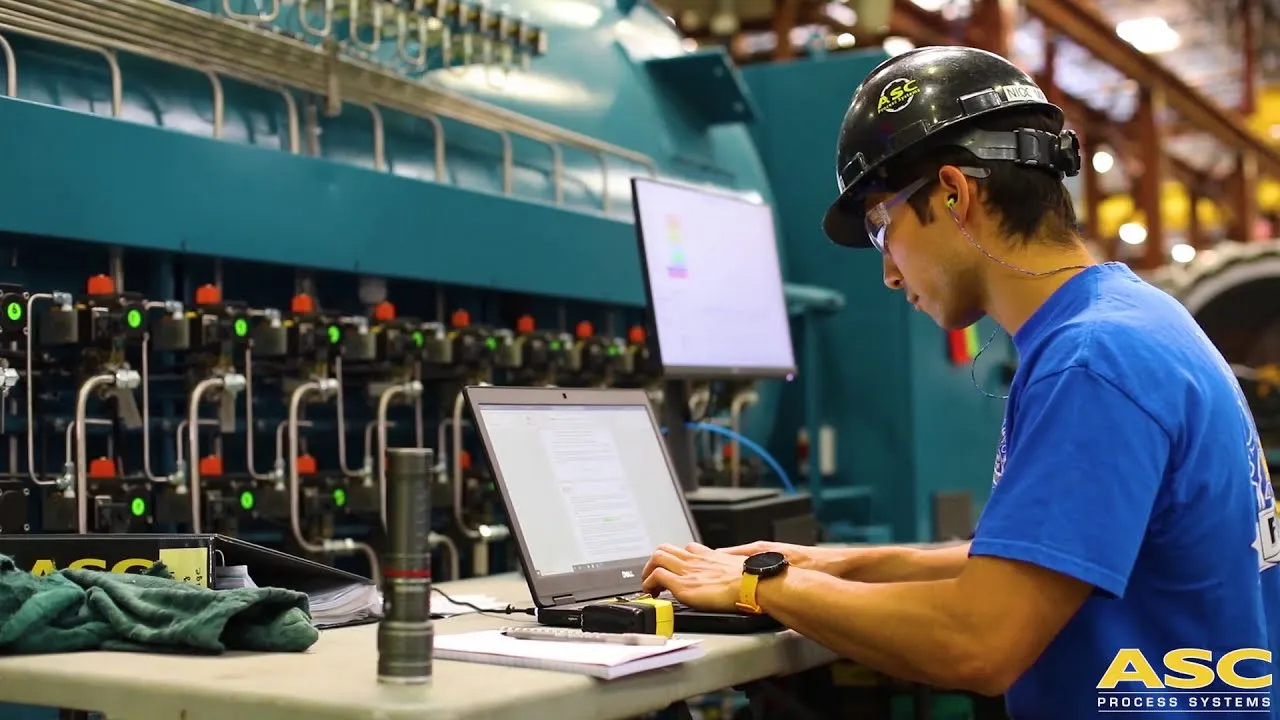 An ASC engineer testing a CPC control system on a laptop