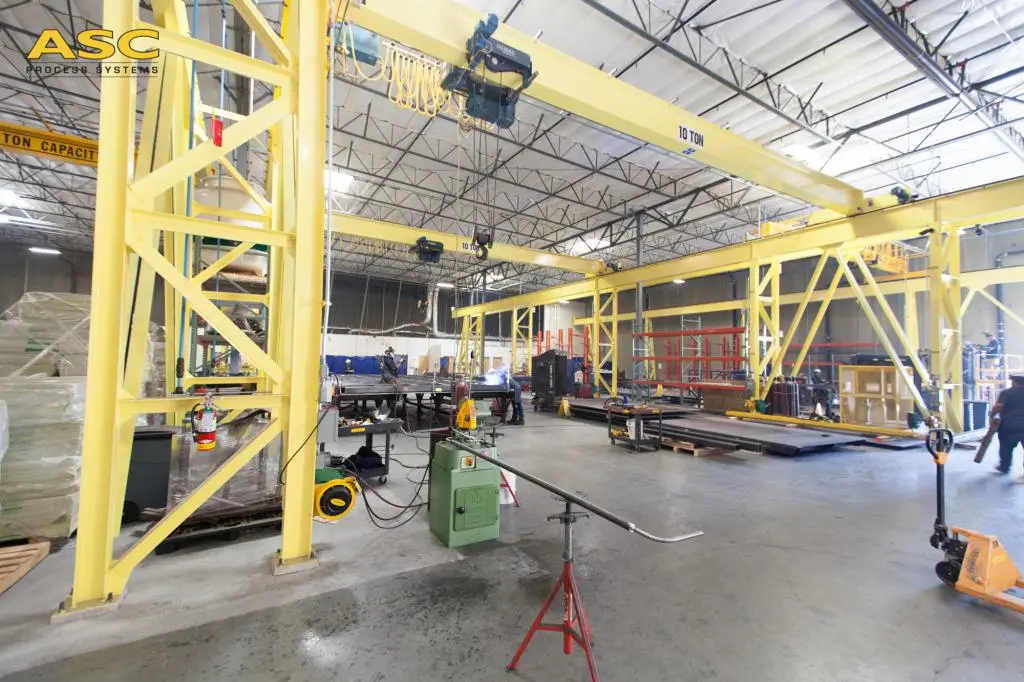 The ASC component fabrication facility in Valencia with cranes and workstations