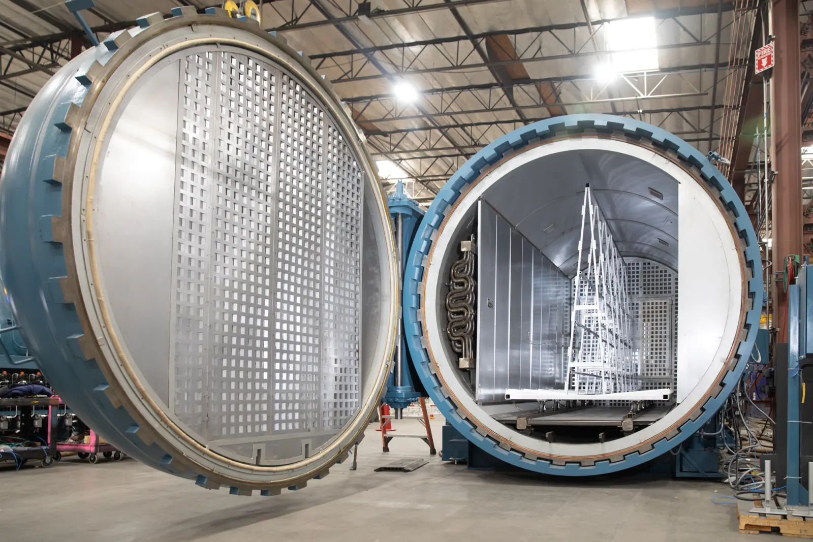 An open ASC Econoclave GLS glass laminating autoclave with a glass rack inside