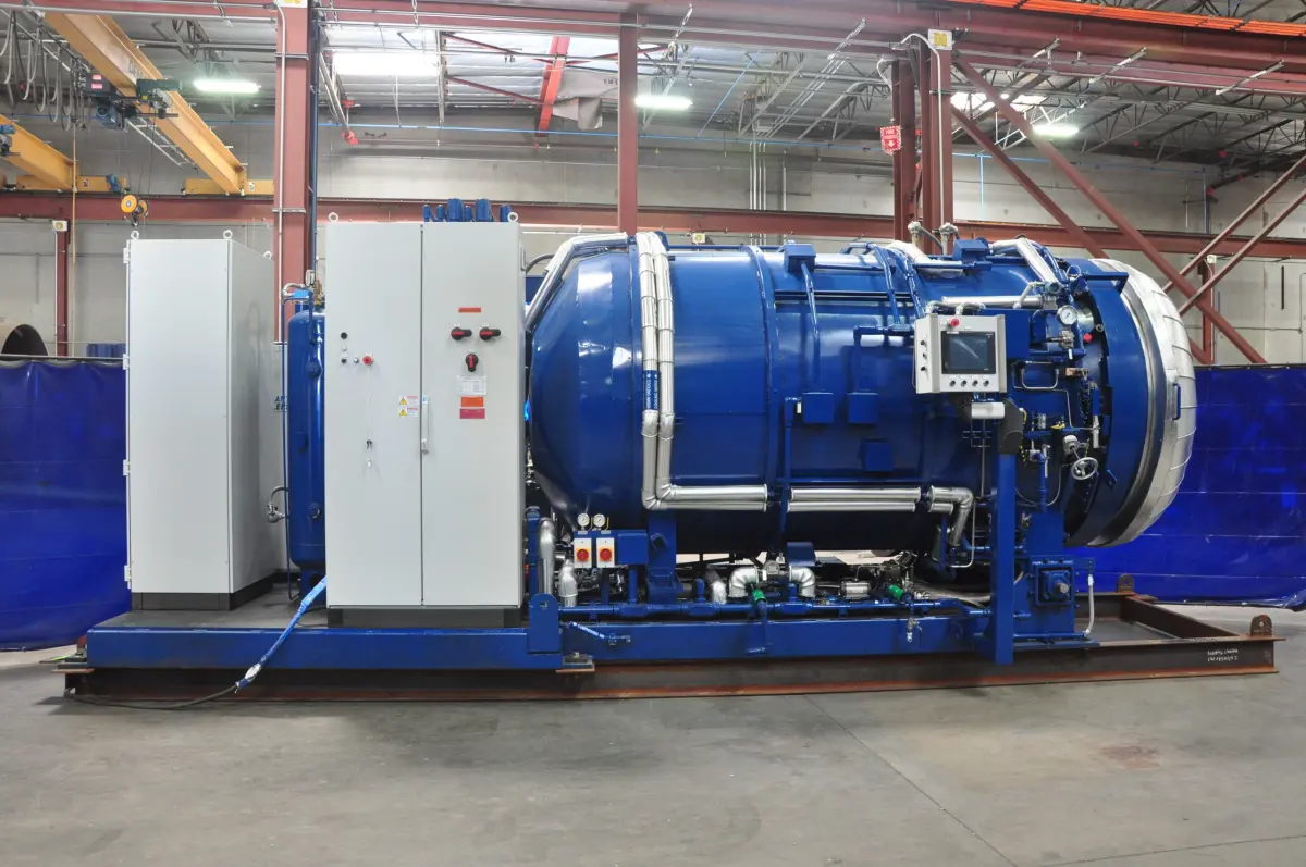 An ASC UF₆ autoclave on its skid beside its control cabinets