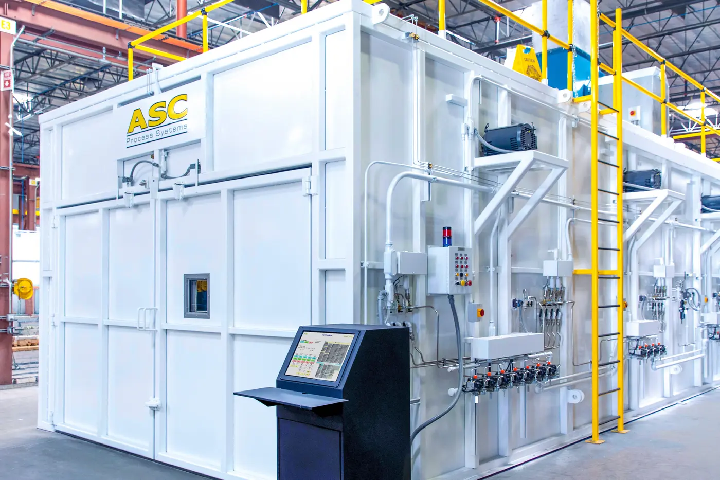 A large ASC composite curing oven with its CPC operator station, vacuum lines, and roof platform