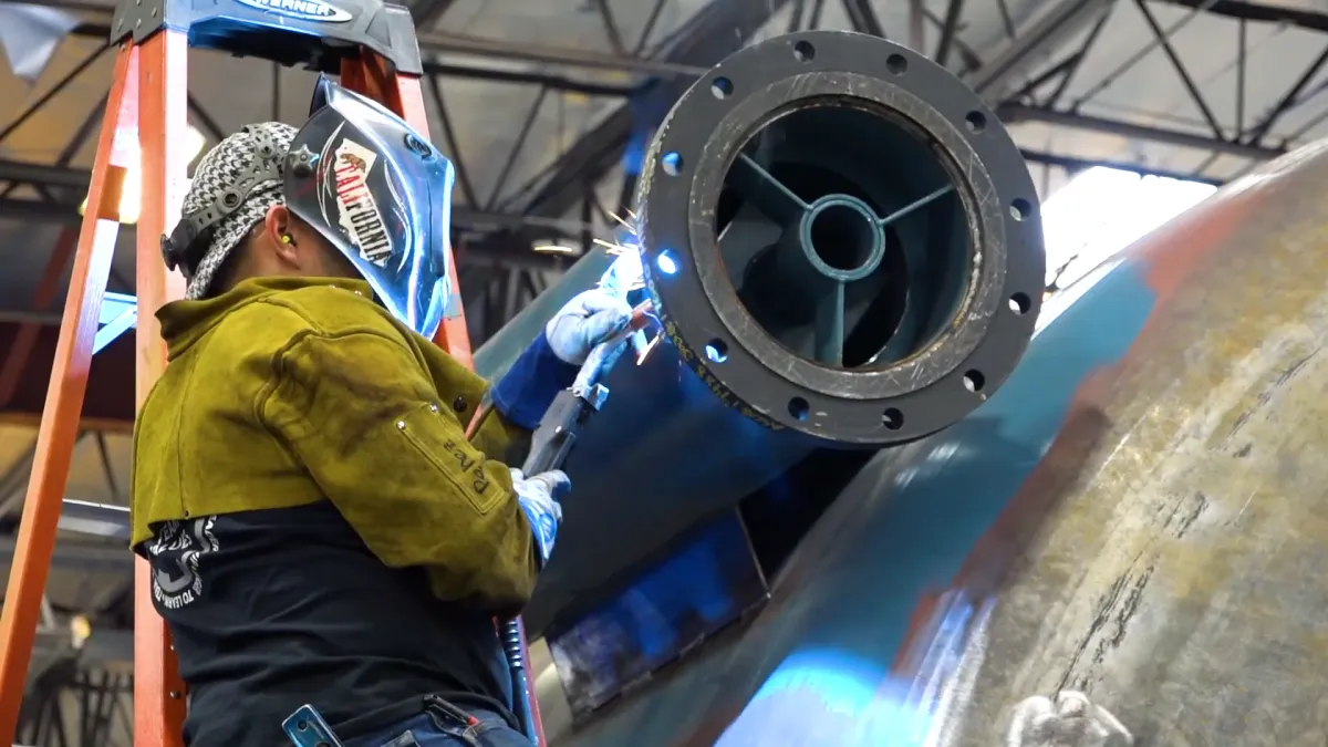 An ASC welder welding a nozzle onto a pressure vessel